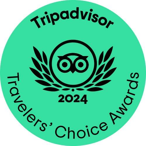 Tripadvisor 2024 Travelers' Choice Awards seal featuring an owl and laurel leaves on a teal background.